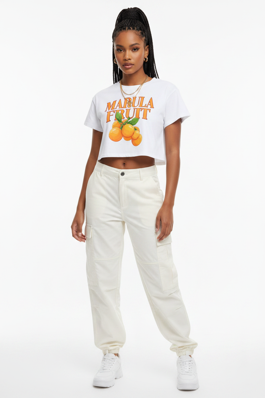 Model wearing white Marula Fruit Baby Tee, medium shot