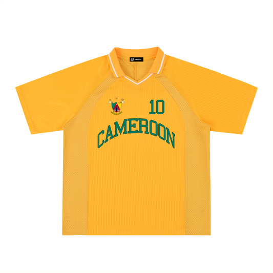 Cameroon sports oversized striped V-neck jersey by ODMPOD featuring bold black and green stripes on white fabric