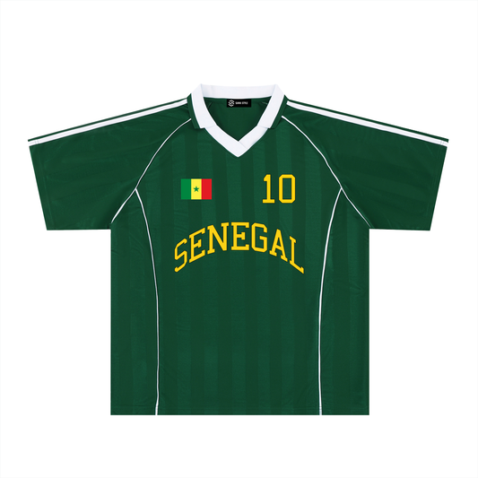 ODMPOD Senegal Sports Stripe Collared Oversized Jersey displayed on a hanger with bold red, green, and yellow stripes.