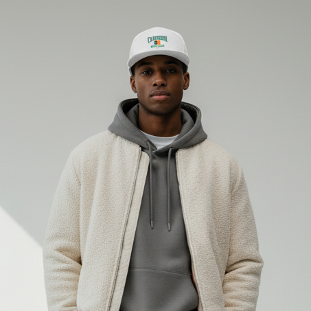 Male model wearing Cameroon flag seven-panel trucker hat