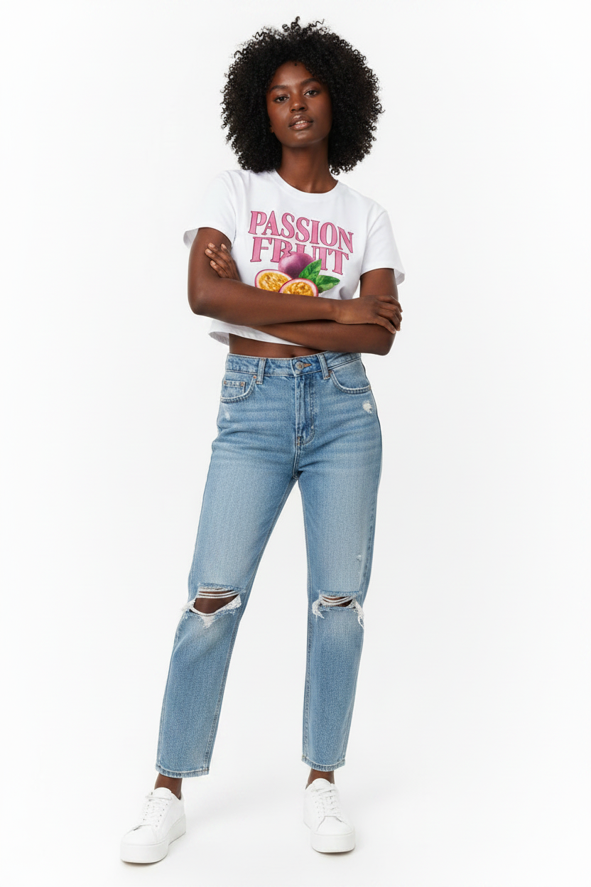 Model wearing white Passion Fruit Baby Tee, medium shot